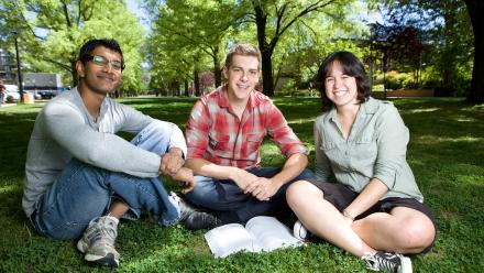 3 students looking at camera